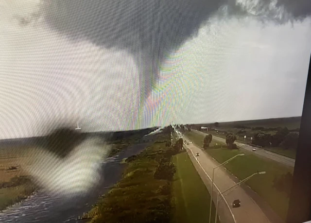 A tornado is pictured crossing the Interstate 75