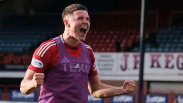 Kevin Nisbet celebrates after Aberdeen's win at Dundee