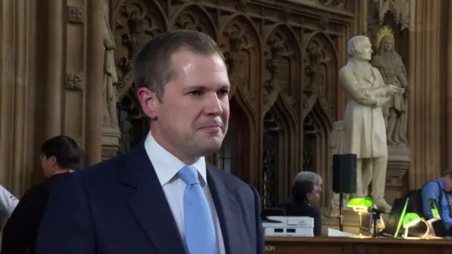 Robert Jenrick talking in the Westminster central lobby