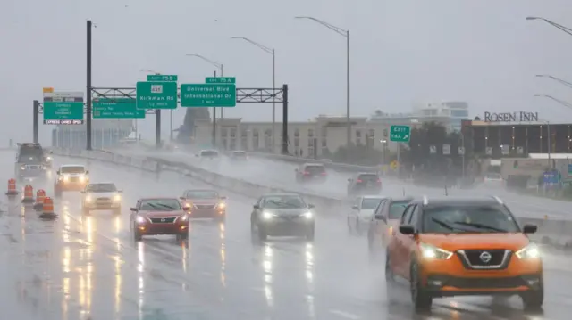 Cars on the highway as heavy rain hits Orlando, Florida.