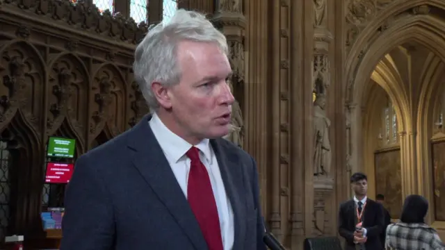 Conservative MP Danny Kruger talking in Westminster lobby