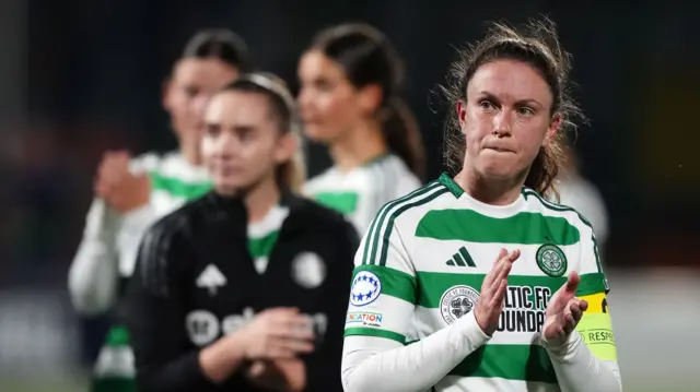 Kelly Clark applauds the Celtic fans following the team's Women's Champions League defeat by Twente