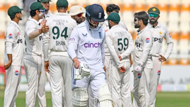 Ben Duckett walks back to the pavilion after his dismissal during the third day of the first Test between Pakistan and England