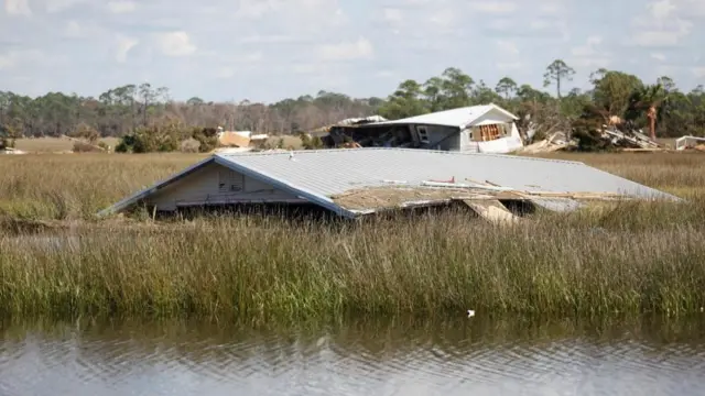 Homes in a marsh after they were lifted from their foundation by a storm surge from Hurricane Helene.