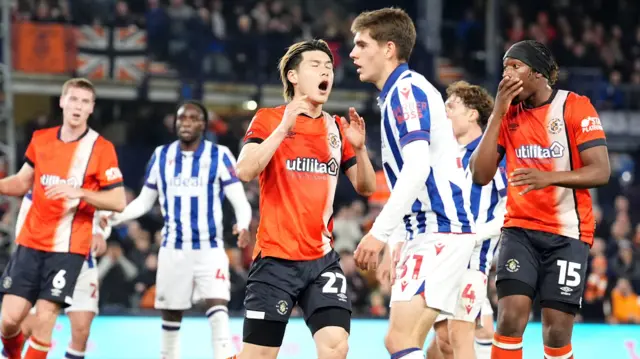 Daiki Hashioka reacts to his header hitting the crossbar