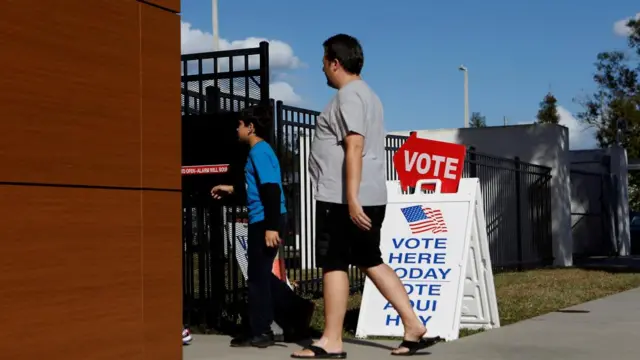 A person walks into an early voting ballot box in Florida