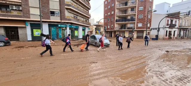 People helping with clear up in Valencia