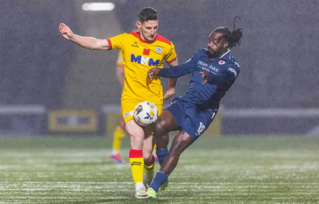 KIRKCALDY, SCOTLAND - NOVEMBER 01: Raith Rovers' Fankaty Dabo and Ayr's Mark McKenzie in action during a William Hill Championship match between Raith Rovers and Ayr United at Stark's Park, on November 01, 2024, in Kirkcaldy, Scotland. (Photo by Ross Parker / SNS Group)