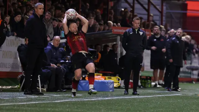 Tamworth's Tom Tonks takes a throw-in