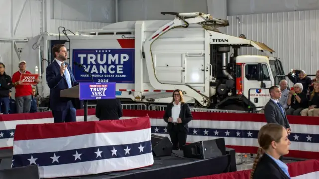 Republican vice presidential nominee and U.S. Senator J.D. Vance speaks from a stage beside a garbage truck at a rally in Portage, Michigan, U.S. November 1, 2024.