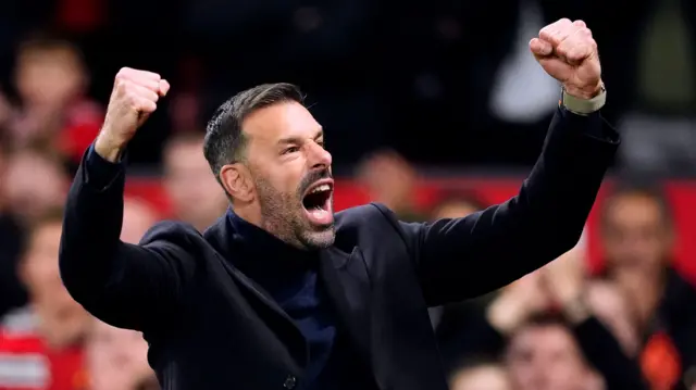 Interim manager Ruud van Nistelrooy raises his fists in celebration during Manchester United's win over Leicester