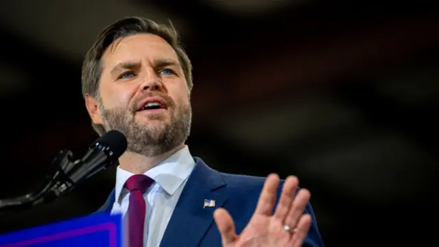 JD Vance photographed a speech at a podium on October 24 in Michigan.