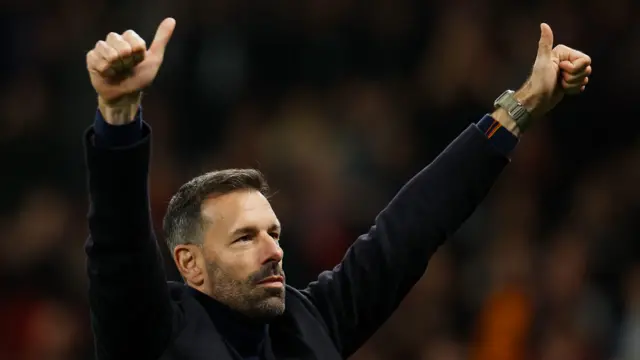 Interim manager Ruud van Nistelrooy gives a thumbs up to the Manchester United fans after his side's win over Leicester