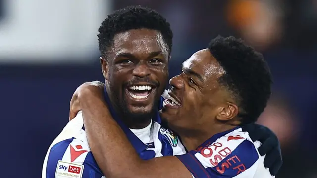 Josh Maja and Grady Diangana celebrate