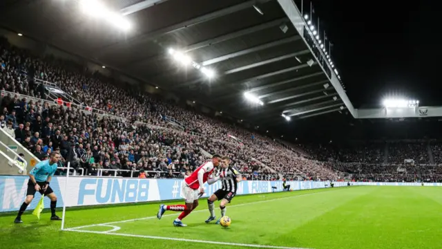 Gabriel of Arsenal battles for the ball against Kieran Trippier of Newcastle