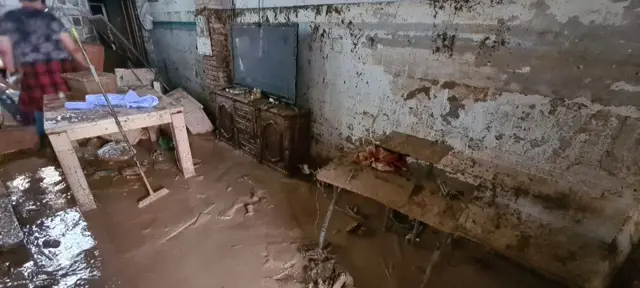 Mud covers the floor of a home in Valencia that has been flooded