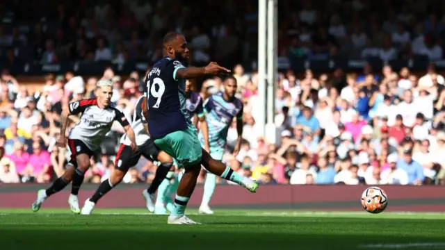 Bryan Mbeumo of Brentford scores the team's second goal from a penalty kick during the Premier League match between Fulham FC and Brentford FC at Craven Cottage