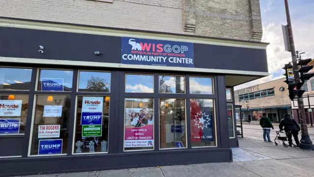 A photo shows a community centre with a banner that reads "WISGOP: Republican of Wisconsin".