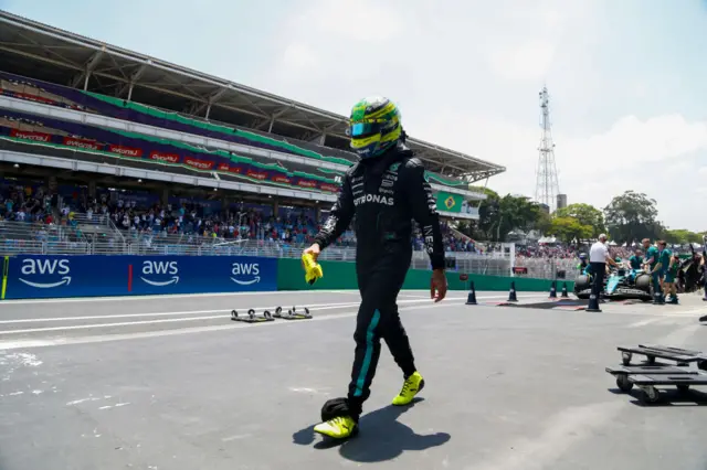 Lewis Hamilton walks back to the pits