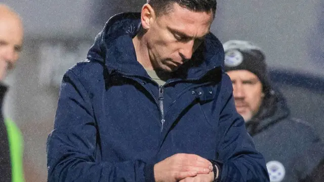 Ayr United manager Scott Brown checks his watch