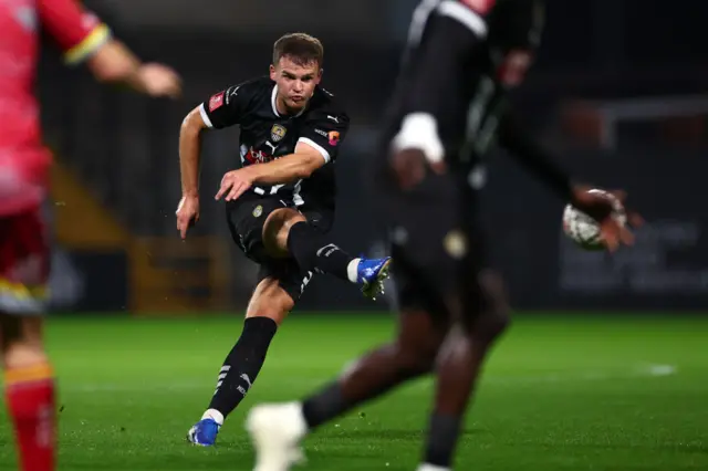 Matthew Platt of Notts County scores