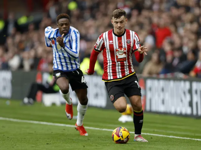 Sheffield United's Harrison Burrows (right) gets past Sheffield Wednesday's Anthony Musaba