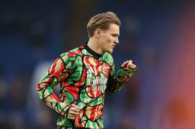 Martin Odegaard warms up for Arsenal ahead of Chelsea