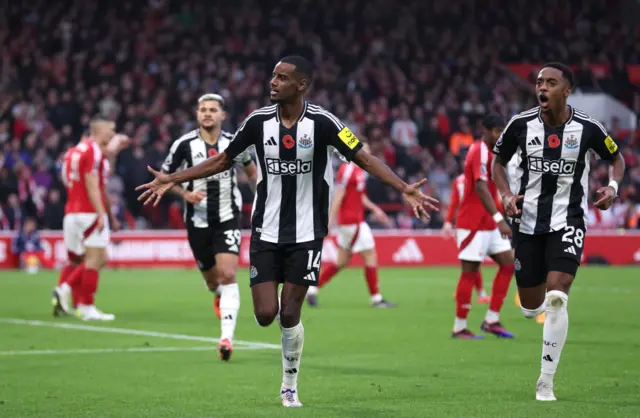 Isak celebrates after scoring for newcastle united