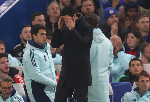 Arsenal manager Mikel Arteta with his head in his hands