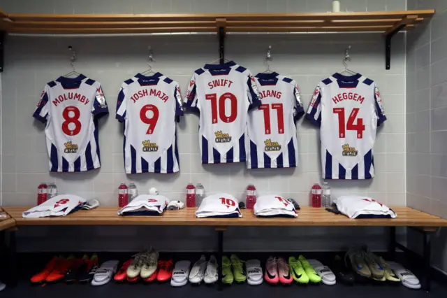 Players of West Bromwich Albion shirts hanging inside the away dressing room