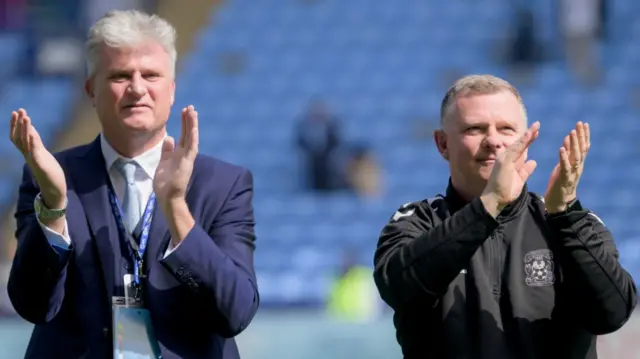 Doug King (left) and Mark Robins acknowledge the Coventry City fans after last season's final game