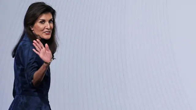 Nikki Haley waves to the audience before giving a speech