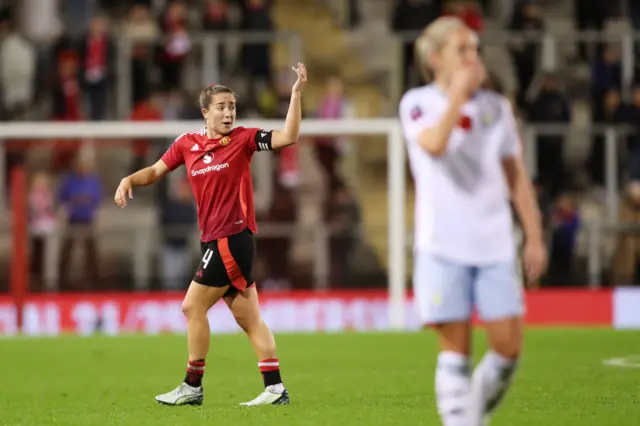 Le Tissier waves and shouts at a teammate