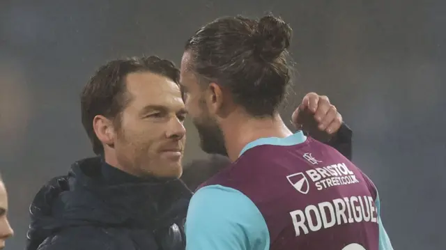 Burnley boss Scott Parker goes over to hug match-winner Jay Rodriguez