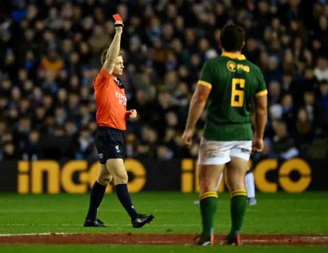 Referee Christophe Ridley shows a red card to Scott Cummings of Scotland (not pictured) following a Bunker Review, as part of the on-going trial this results in a 20 minute Sin Bin for Scott Cummings before Scotland are allowed to make a red card replacement, during the Autumn Nations Series 2024 match between Scotland and South Africa at the Scottish Gas Murrayfield on November