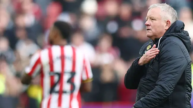 Chris Wilder pats his heart