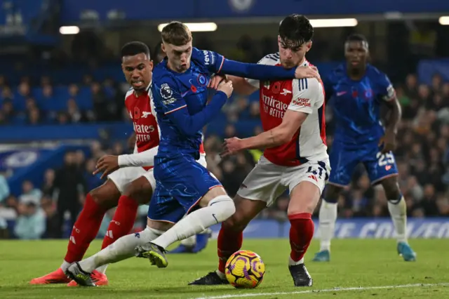 Cole Palmer tussles with Declan Rice