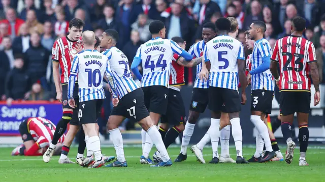 Sheffield United and Sheffield Wednesday players square up to each other