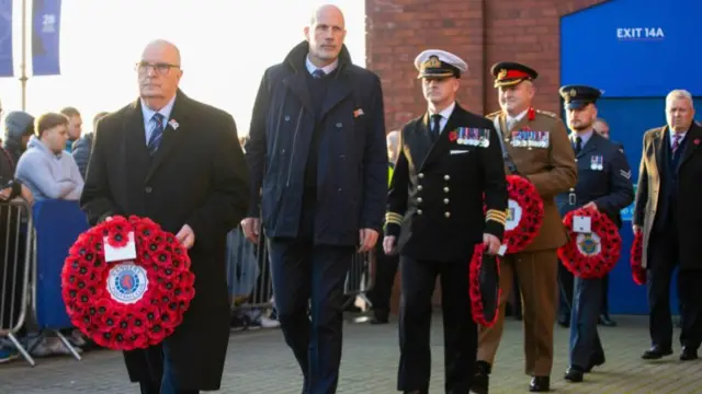 Rangers interim chairman John Gilligan (left) and manager Philippe Clement as a wreath is laid outside Ibrox