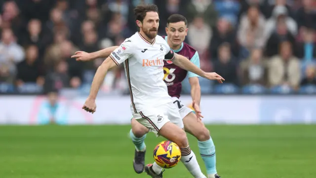 Joe Allen of Swansea City and Josh Cullen of Burnley