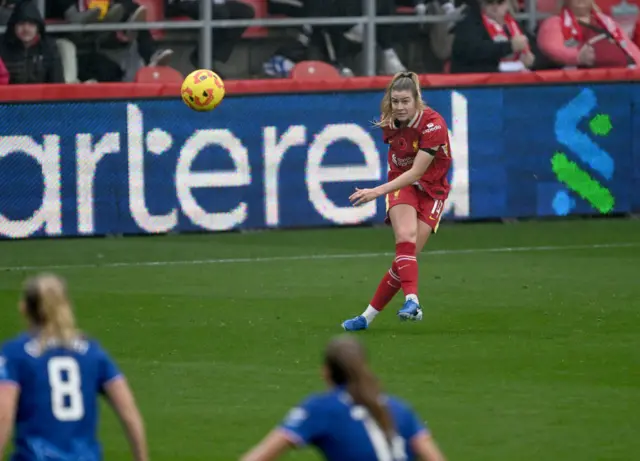 Hobinger crosses the ball for Liverpool