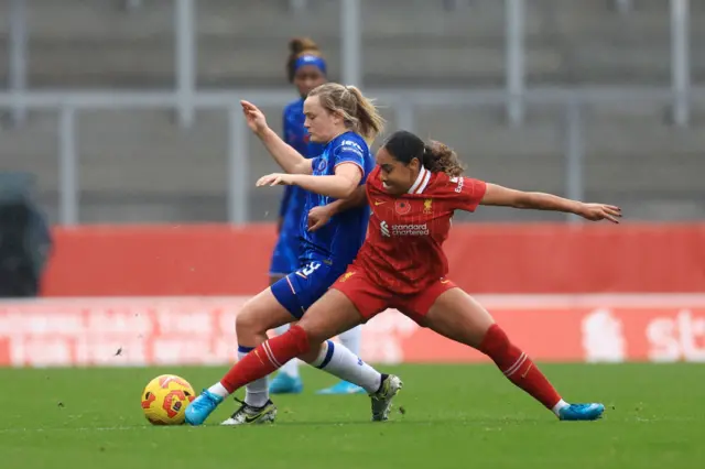 Erin Cuthbert and Olivia Smith duel for the ball