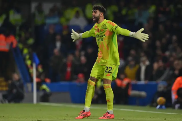 David Raya gestures to his Arsenal teammates