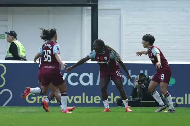 Asseyi celebrates her goal v Leicester with her teammates