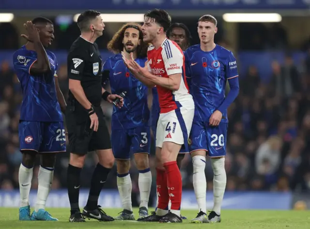 Declan Rice pleads with referee Michael Oliver