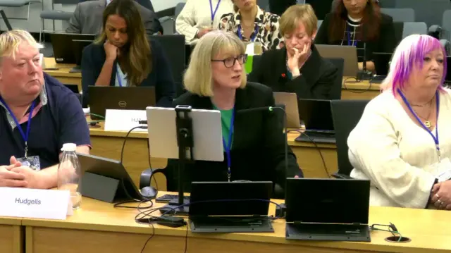 Angela Patrick at the Post Office inquiry sat behind a bank of computer screens