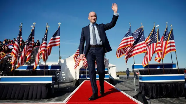 Stephen Miller walks onstage at a Trump rally