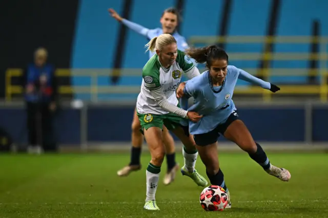 Jonna Andersson fights for the ball with Mary Fowler