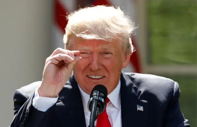 U.S. President Donald Trump (making gesture with his fingers, hand gestures) as he refers to amounts of temperature change as he announces his decision that the US will withdraw from the landmark Paris Climate Agreement