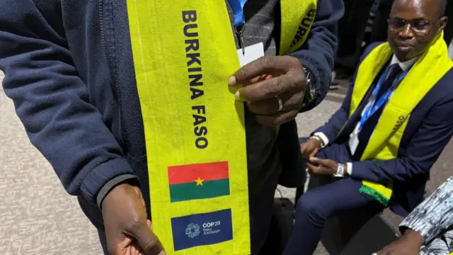 The delegation are wearing snazzy scarfs made just for these talks